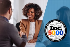 a person shakes another's hand behind the In.c 500 logo