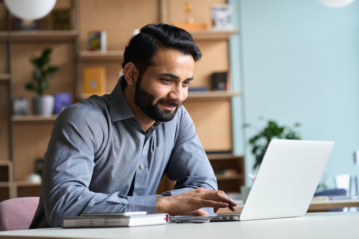 A man reading about the benefits of FinPay for employees