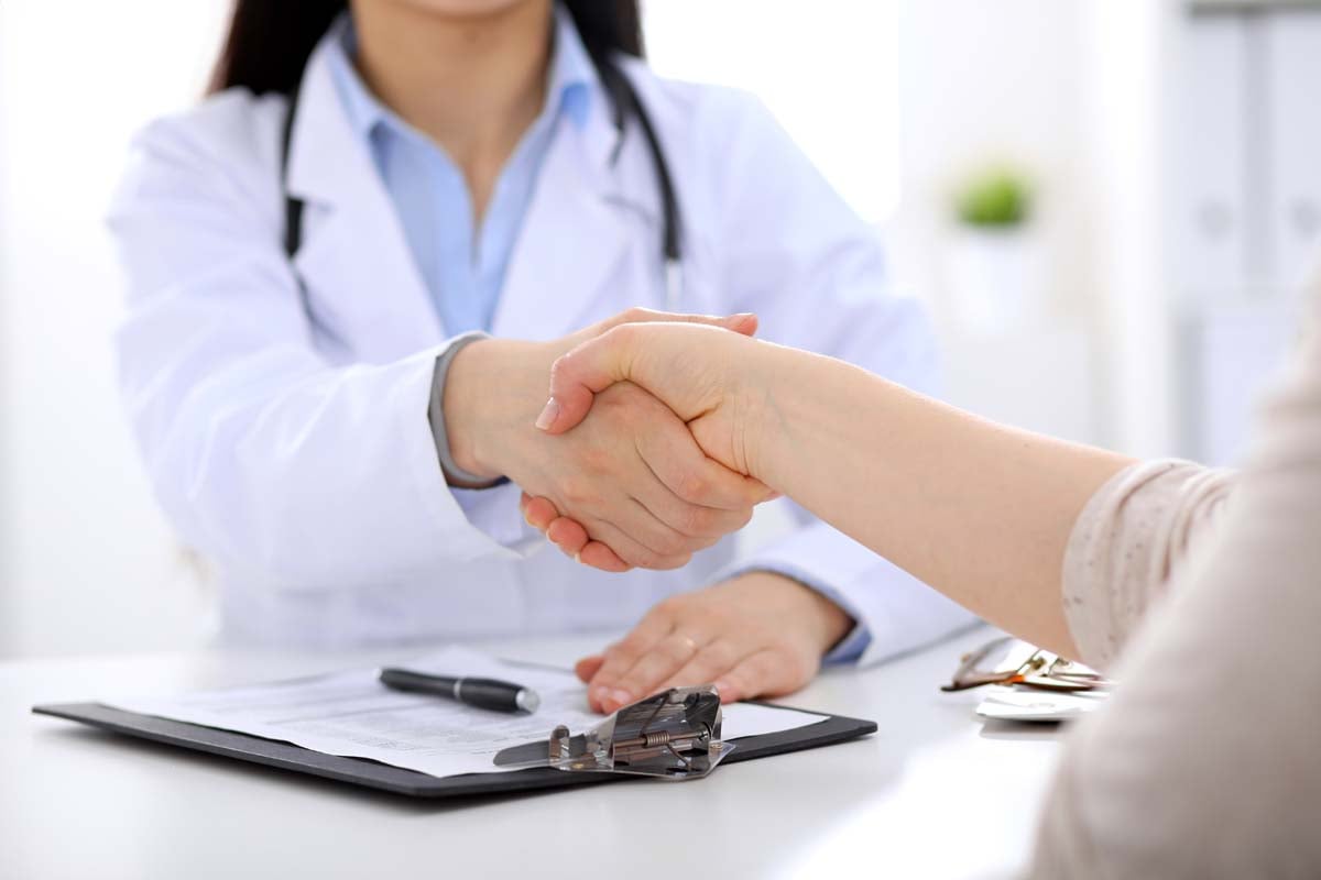 doctor shaking hands with patient after giving best consumer experience in healthcare 