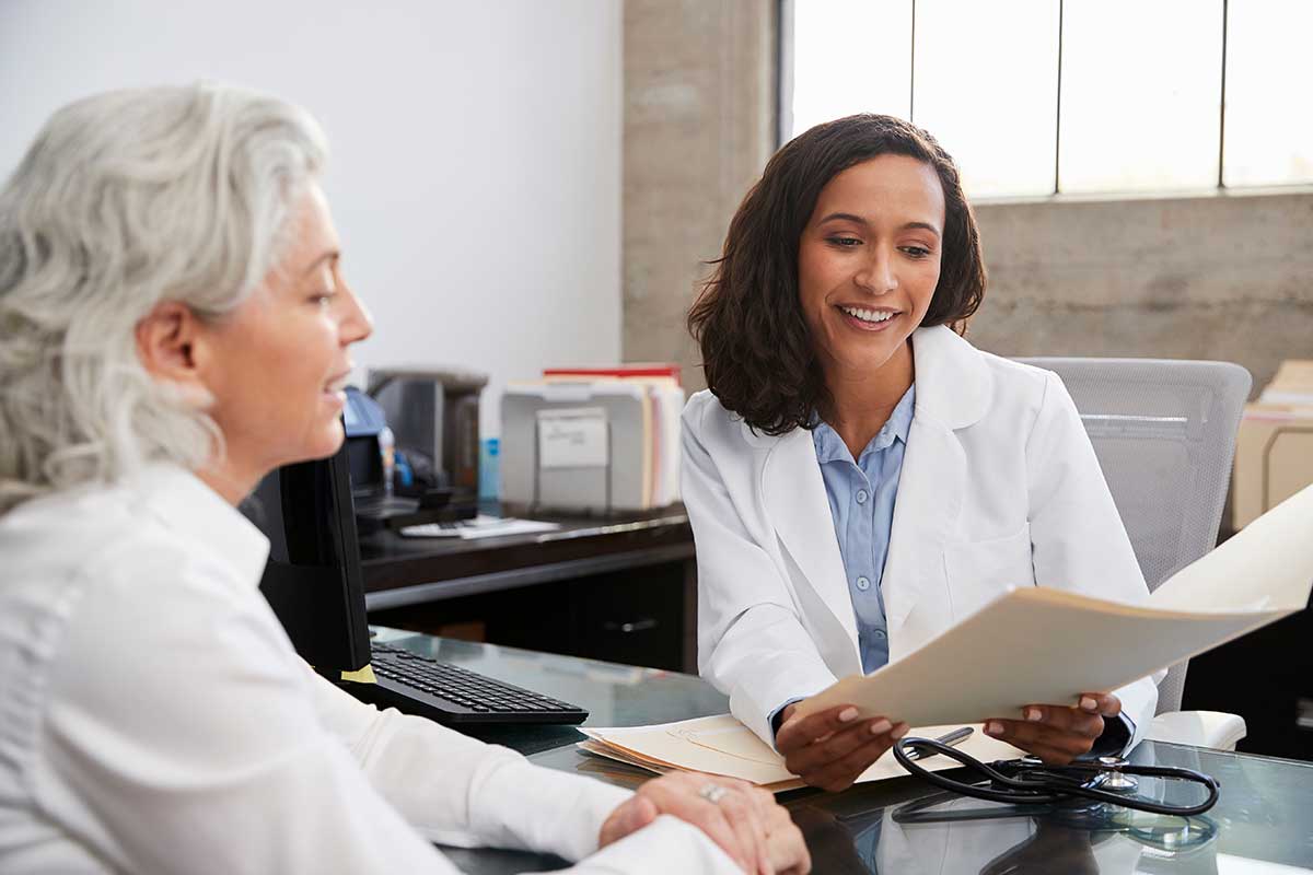 Doctor showing patient how healthcare providers can offer financial solutions to their patients 